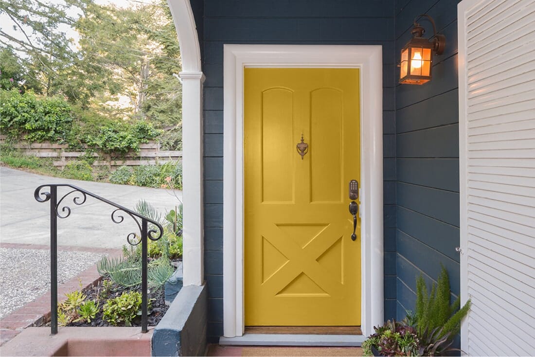 Yellow front door painted with Beauti-Tone paint